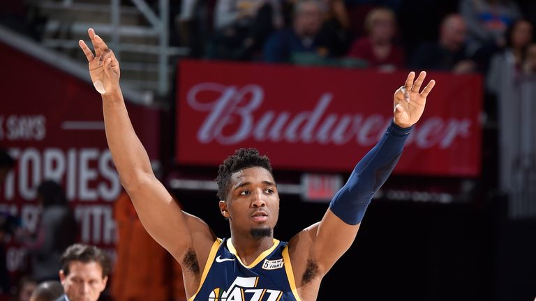 Donovan Mitchell salutes the crowd after draining a three-pointer