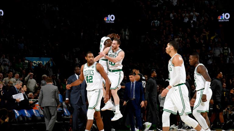 Gordon Hayward celebrates with team-mate Jaylen Brown