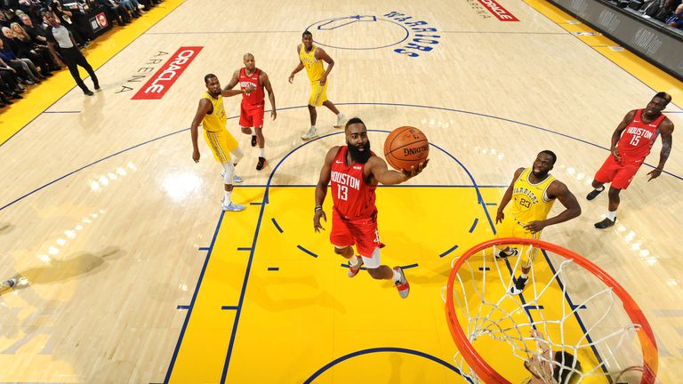 James Harden scores with a finger roll against the Warriors