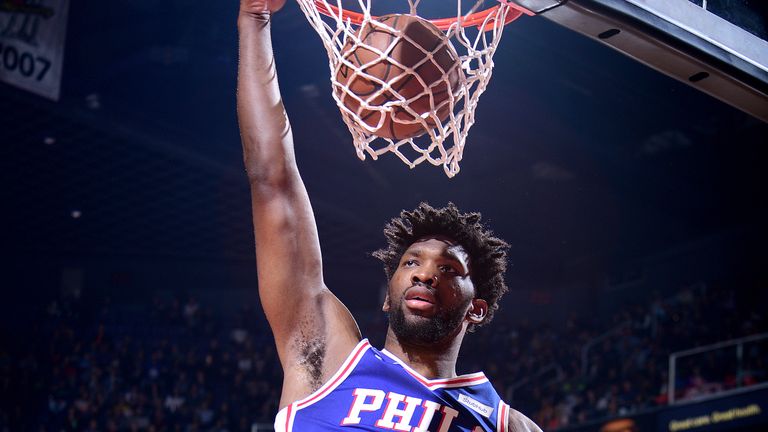 Joel Embiid scores with a dunk against Phoenix