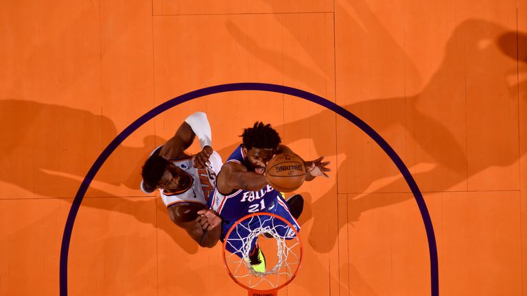 Joel Embiid dunks hard against the Phoenix Suns