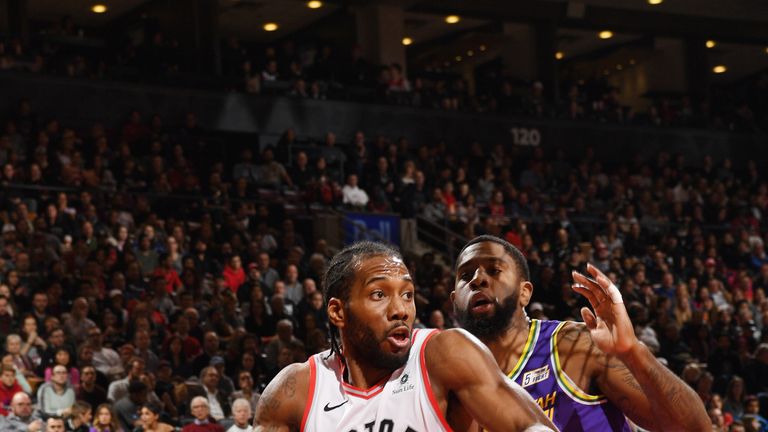 Kawhi Leonard drives at the heart of Utah's defense