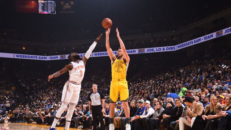 Klay Thompson fires a jump shot over Tim Hardaway Jr