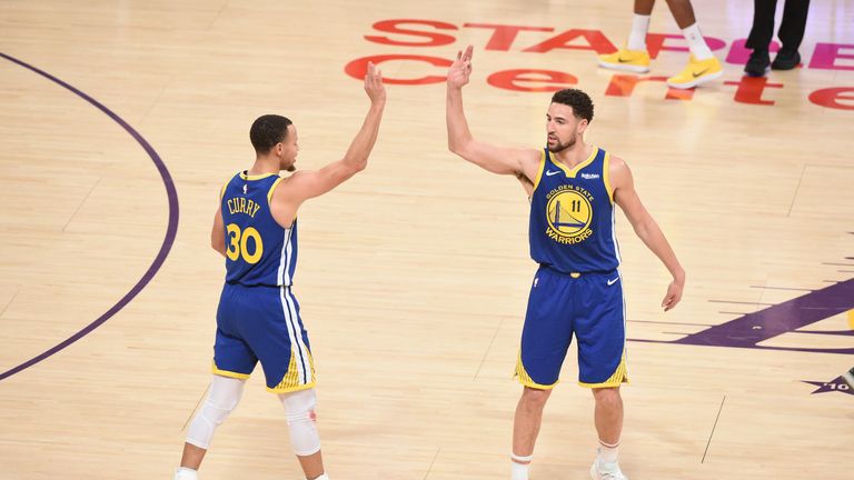 Klay Thompson high-fives backcourt partner Stephen Curry