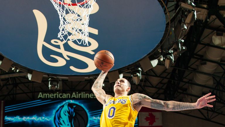 Kyle Kuzma soars for a dunk against Dallas