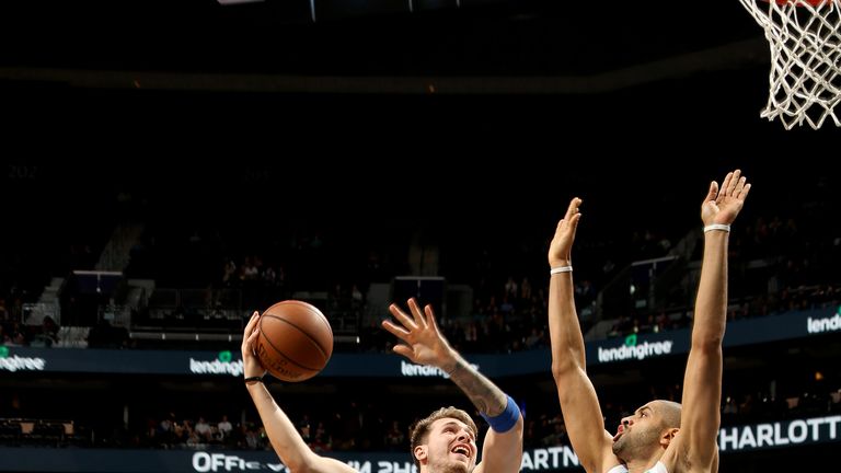 Luka Doncic lofts a sky hook against Charlotte