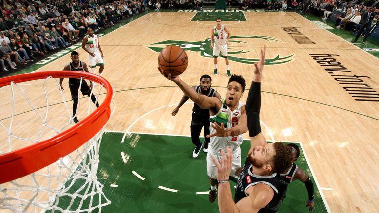 Malcolm Brogdon scores against the Detroit Pistons