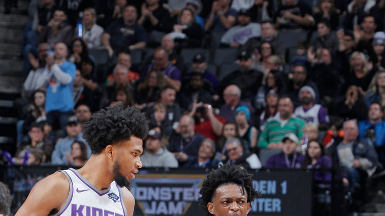 Sacramento Kings young guns Marving Bagley III and De'Aaron Fox exchange views on the court