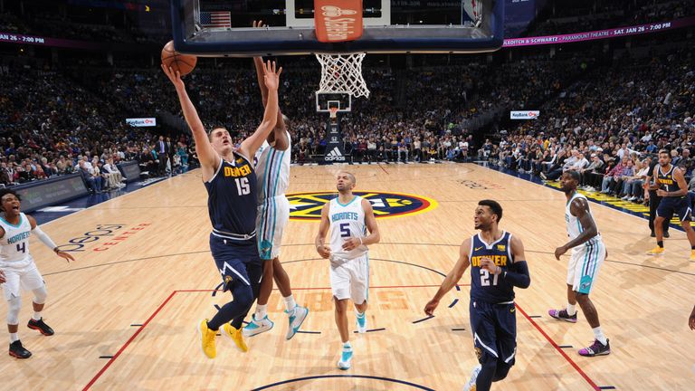 Nikola Jokic attacks the basket against Charlotte