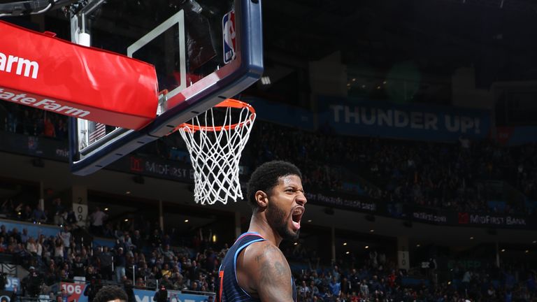 Paul George roars after a basket against the Bucks