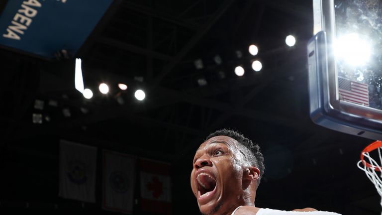 Russell Westbrook celebrates after hammering home a tomahawk dunk
