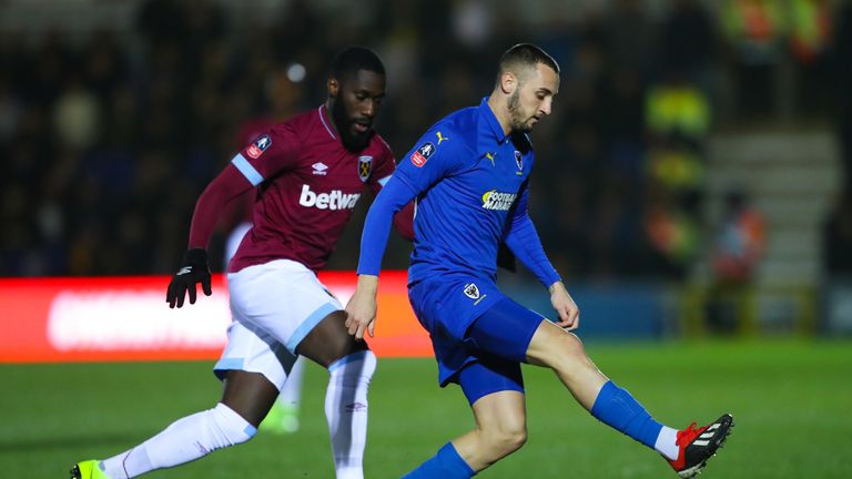 Dylan Connolly of AFC Wimbledon competes for the ball with Arthur Masuaku of West Ham United during the FA Cup Fourth Round match between AFC Wimbledon and West Ham United at The Cherry Red Records Stadium on January 26, 2019 in Kingston upon Thames, United Kingdom.