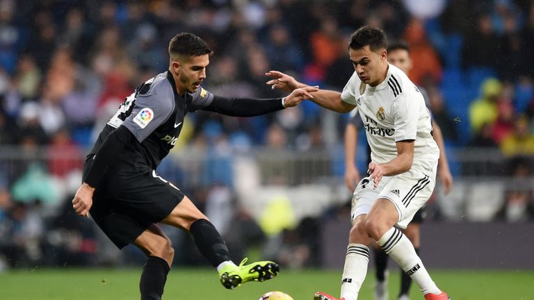 Andre Silva of Sevilla battles for possession with Sergio Reguilon of Real Madrid 