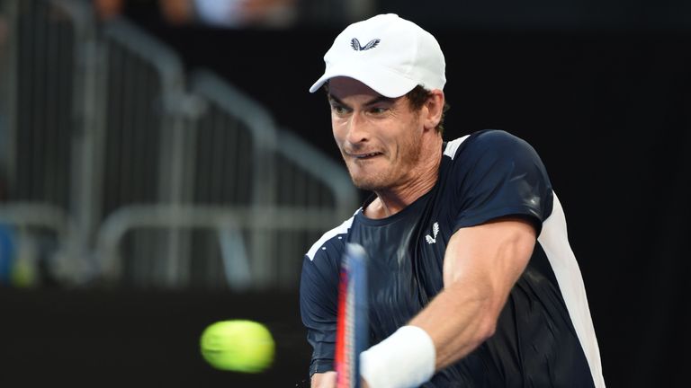 Andy Murray plays a backhand return to Roberto Bautista Agut during their first round men's singles match