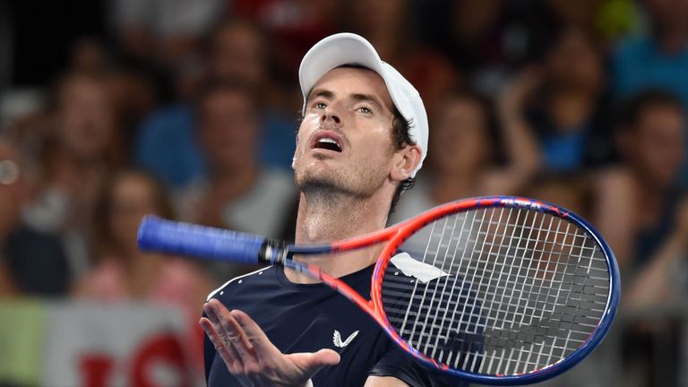 Andy Murray tosses his racket as he reacts after a point during his men's singles match against Roberto Bautista Agut