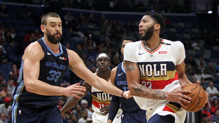 Anthony Davis of the New Orleans Pelicans drives the ball around Marc Gasol of the Memphis Grizzlies