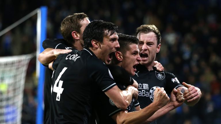 Ashley Barnes (far right) celebrates with team-mates after scoring the winning goal in the 2-1 defeat of Huddersfield Town