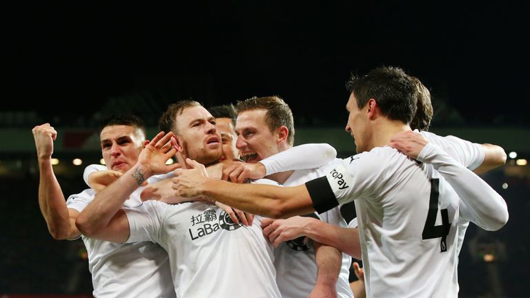 Ashley Barnes celebrates with team-mates after Burnley take the lead at Old Trafford