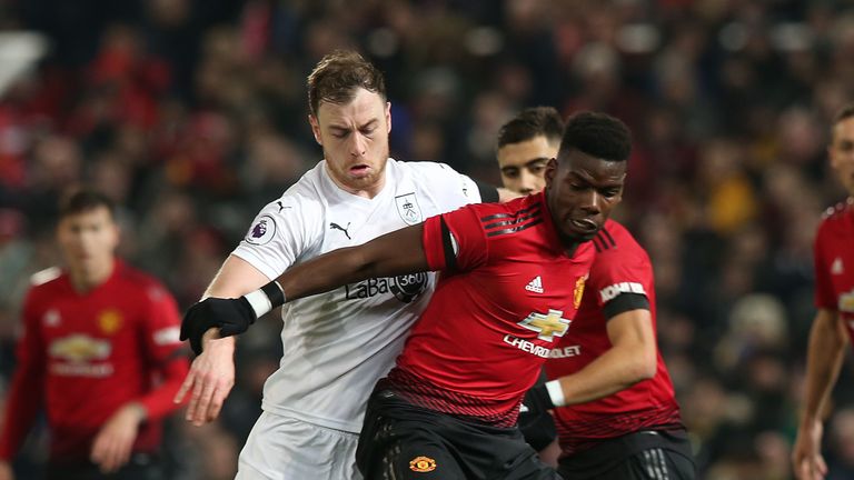 Ashley Barnes and Paul Pogba battle for possession