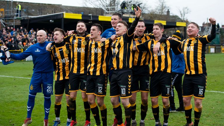 Auchinleck Talbot players celebrate their win with the fans at full time
