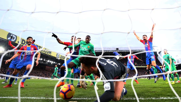 Ben Foster attempts to clear the ball as Crystal Palace score the first goal of the game