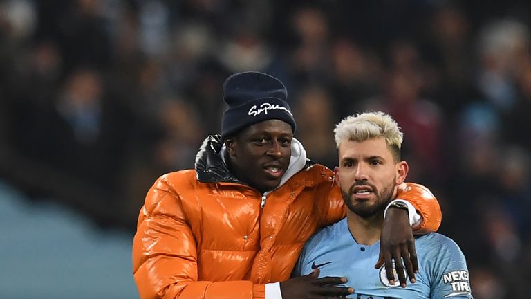 Benjamin Mendy congratulates Manchester City team-mate Sergio Aguero at full-time