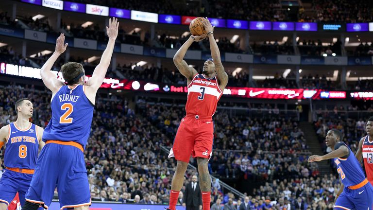 Washington guard Bradley Beal shoots over New York Knicks center Luke Kornet