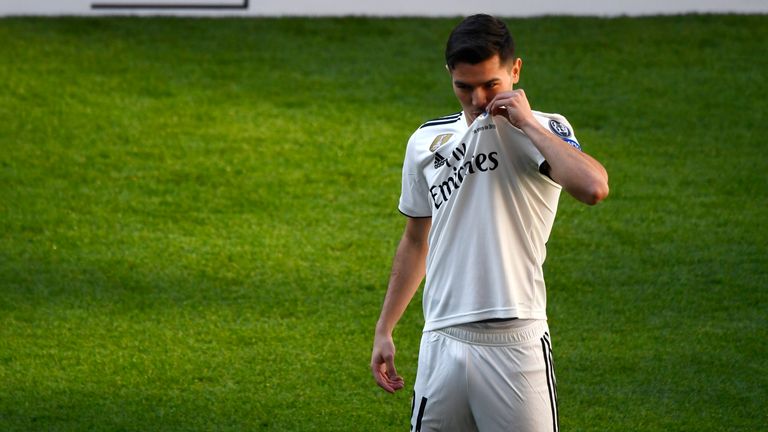 Brahim Diaz kisses the Real Madrid club badge during his official presentation after signing from Manchester City