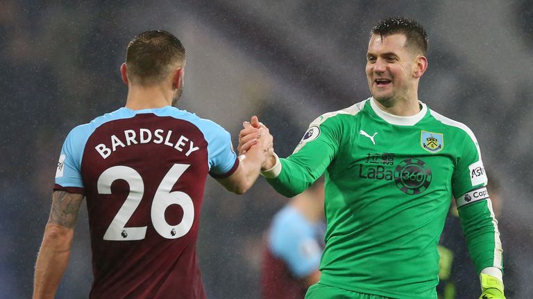 Phil Bardsley and Tom Heaton celebrate following the Premier League match between Burnley FC and Fulham FC at Turf Moor on January 12, 2019 in Burnley, United Kingdom.