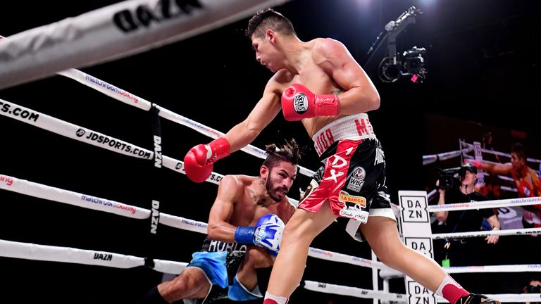 Pablo Cesar Cano of Mexico punches Jorge Linares of Venezuela during their junior welterweights fight at The Hulu Theater at Madison Square Garden