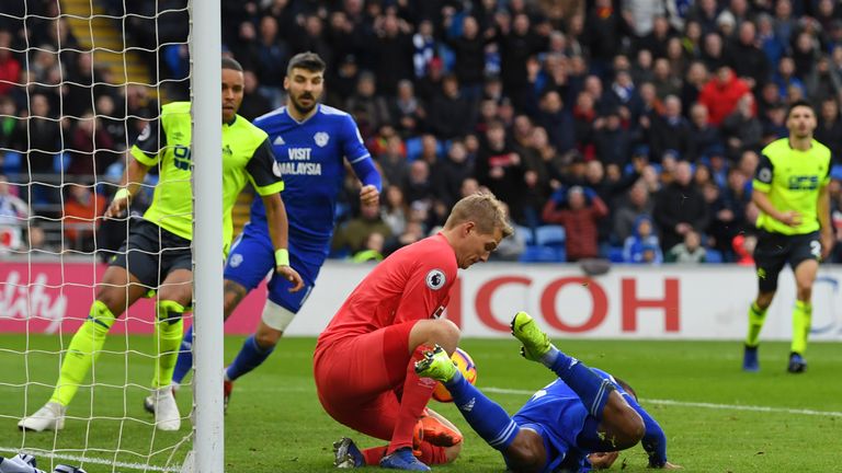 Jonas Lossl saves at the feet of Junior Hoilett during a rare Cardiff attack on Saturday