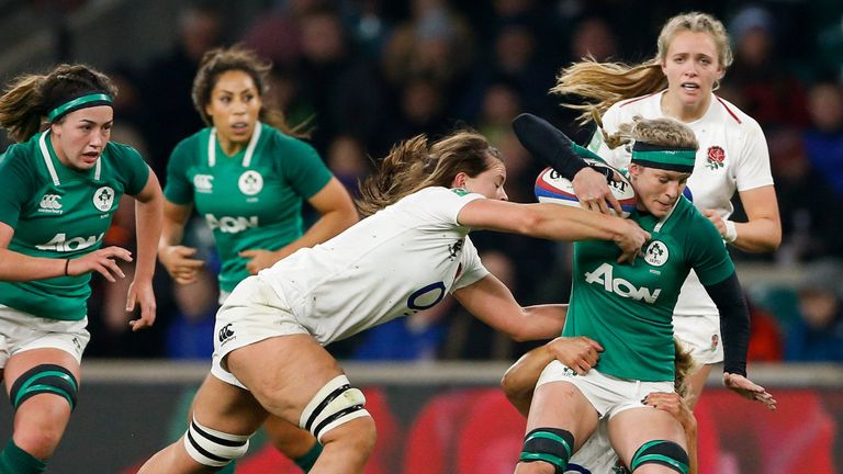  Claire Molloy of Ireland is tackled by Abbie Scott and Vicky Felletwood of England.