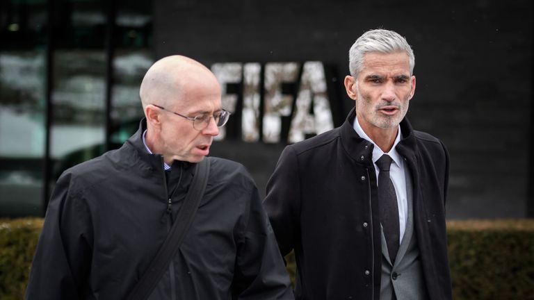 Craig Foster (R) leaves the FIFA headquarters in Zurich next to World Players Association's executive director Brendan Schwab