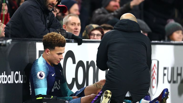 Dele Alli of Tottenham reacts to an injury during the Premier League match between Fulham FC and Tottenham Hotspur at Craven Cottage on January 20, 2019 in London, United Kingdom.