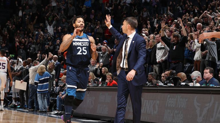 Derrick Rose #25 of the Minnesota Timberwolves high-fives Ryan Saunders of the Minnesota Timberwolves after hitting game winning shot against the Phoenix Suns on January 20, 2019 at Target Center in Minneapolis, Minnesota.