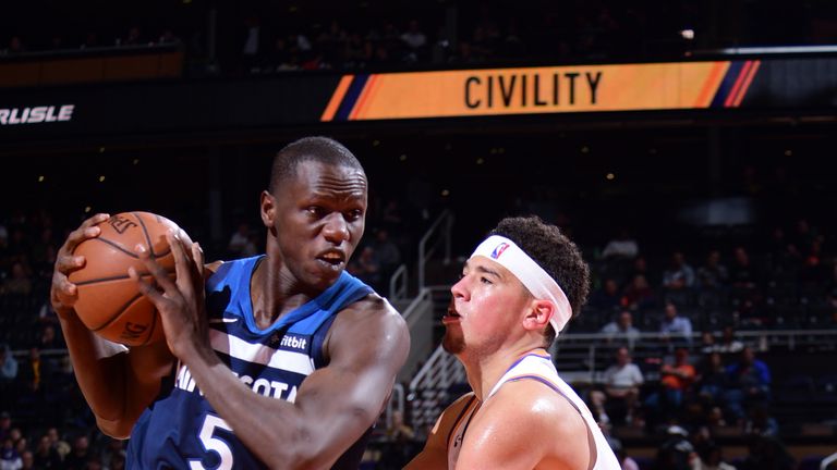 PHOENIX, AZ - JANUARY 22: Gorge Dieng #5 of the Minnesota Timberwolves drives past Devin Booker #1 of the Phoenix Suns on January 22, 2019 at Talking Stick Resort Arena in Phoenix, Arizona. NOTE TO USER: User expressly acknowledges and agrees that, by downloading and or using this photograph, user is consenting to the terms and conditions of the Getty Images License Agreement. Mandatory Copyright Notice: Copyright 2019 NBAE (Photo by Michael Gonzales/NBAE via Getty Images)