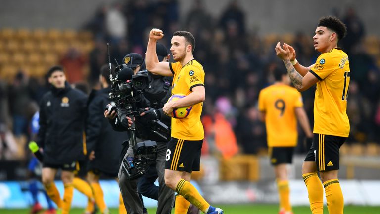 Diogo Jota celebrates with the match ball after his hat-trick secures a 4-3 win over Leicester City
