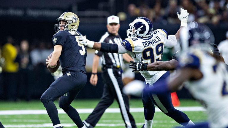 Donald tries to get to Saints quarterback Drew Brees