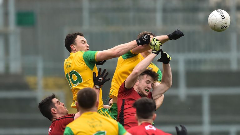 Spot the ball: Donegal and Down players compete for possession in the McKenna Cup