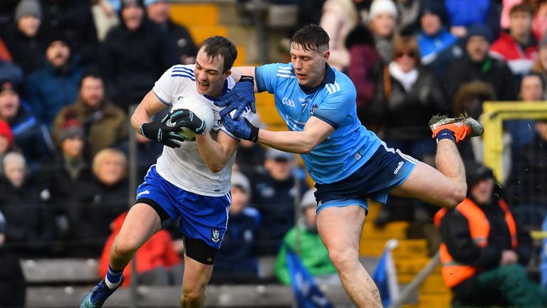 Jack McCarron of Monaghan is challenged by John Small of Dublin