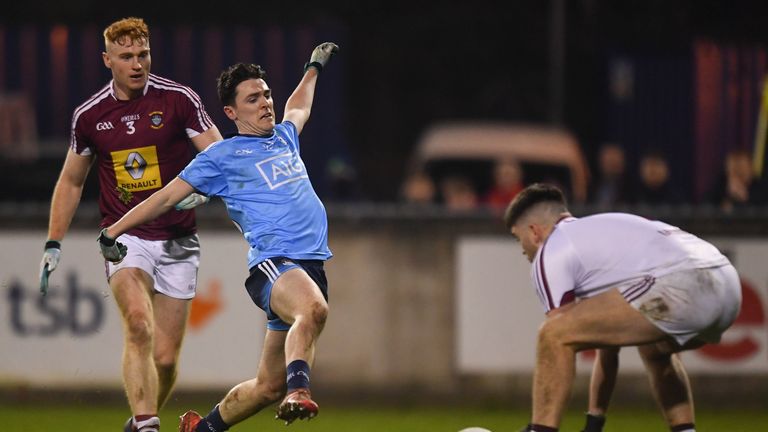Stephen Smith of Dublin races in to challenge Westmeath goalkeeper Eoin Carberry