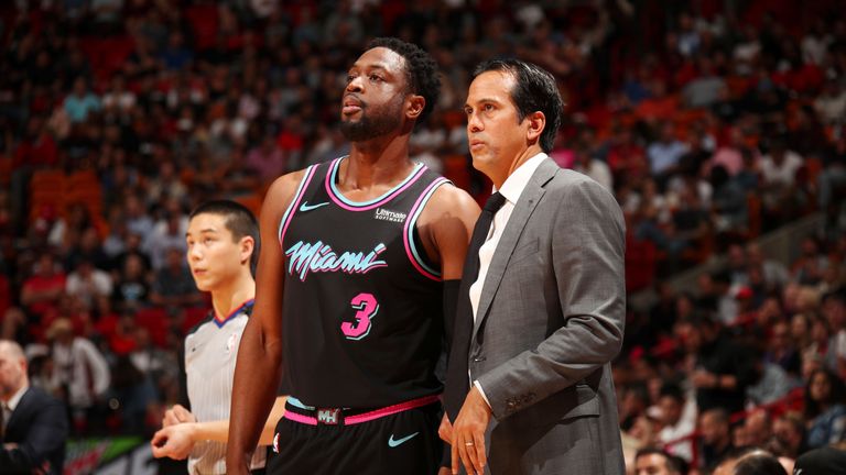 Dwyane Wade speaks with Miami Heat head coach Erik Spoelstra during the game against the Denver Nuggets