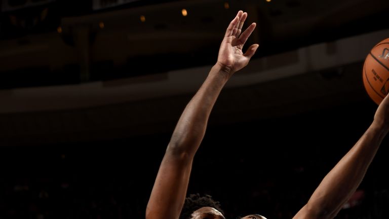 Joel Embiid of the Philadelphia 76ers blocks the shot by James Harden of the Houston Rockets