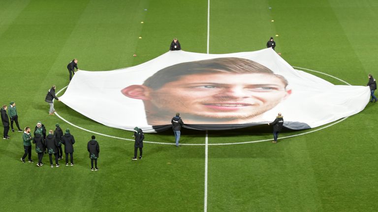 A banner showing Emiliano Sala's face is held at the centre circle ahead of kick-off at Nantes' Ligue 1 fixture with Saint-Etienne