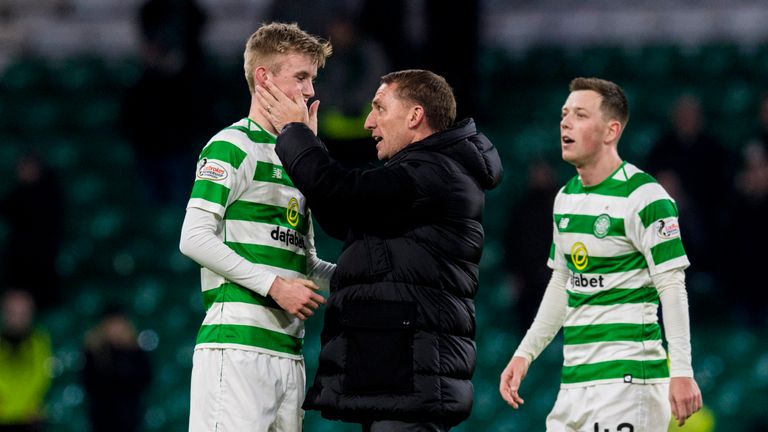 Celtic manager Brendan Rodgers with Ewan Henderson (left)