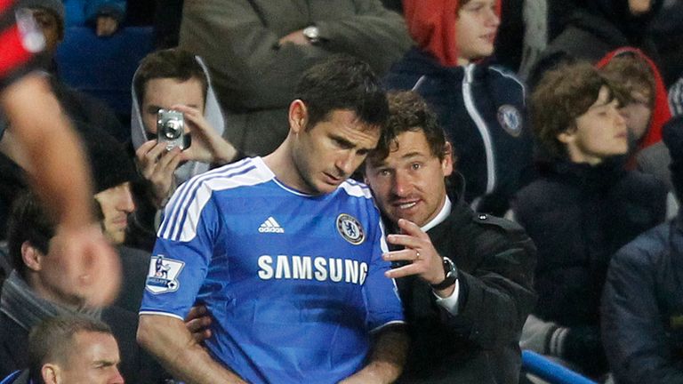 Chelsea's Portuguese Manager Andre Villas-Boas (R) talks to Chelsea's Frank Lampard before he comes on as a substitute during an English Premier League football match between Chelsea and Manchester City at Stamford Bridge in London, on December 12, 2011. 