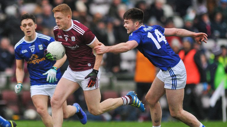 Kieran Duggan of Galway bursts past Thomas Galligan of Cavan