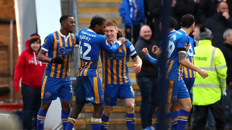 Greg Docherty of Shrewsbury Town celebrates with team-mates after scoring his team's first goal during the FA Cup Fourth Round match between Shrewsbury Town and Wolverhampton Wanderers at New Meadow on January 26, 2019 in Shrewsbury, United Kingdom