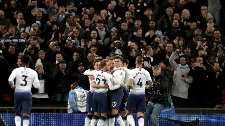 Tottenham Hotspur&#39;s Harry Kane is mobbed by team-mates after scoring his side&#39;s first goal of the game during the Carabao Cup, semi final match at Wembley, London.