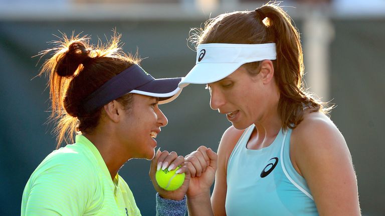 Heather Watson and Johanna Konta of Great Britain confer between points while playing Ekaterinsa Makarova and Elena Vesnina of Russia during the Miami Open Presented by Itau at Crandon Park Tennis Center on March 25, 2018 in Key Biscayne, Florida. 